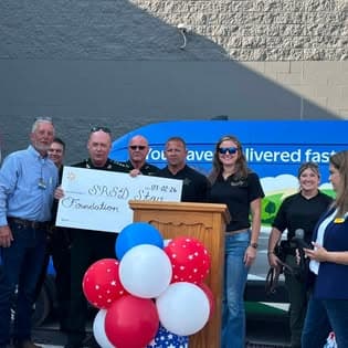 Representatives present a donation check to the SRSO STAR Foundation